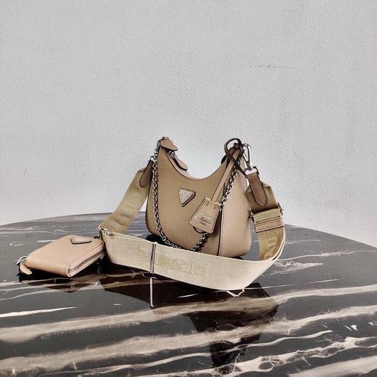 65324fc40fa3b.jpg Replica Prada 1BH204 Prada Re-Edition 2005 Saffiano leather Bag in Apricot Silver - Image 1