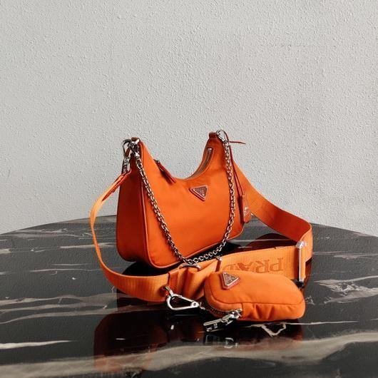 653256cfeae65.jpg Replica Prada 1BH204 Prada Re-Edition 2005 Nylon Bag Orange - Image 1