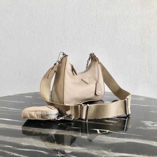 653256e934db9.jpg Replica Prada 1BH204 Prada Re-Edition 2005 Nylon Bag Apricot - Image 1
